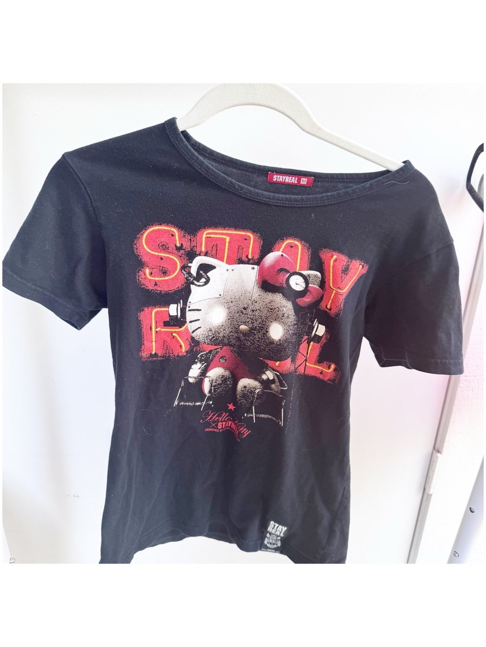 Stay Real Black Graphic Tee with Red Accent - Women's Short Sleeve hello kitty